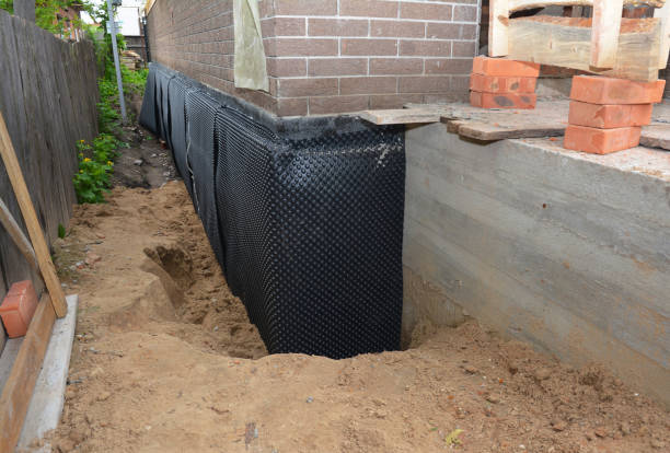 SJ Waterproofing Pros technician performing targeted Basement Waterproofing assessment in Kechi, KS